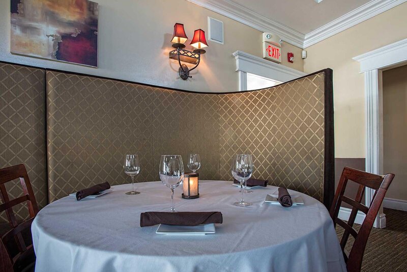 Dining room with round table set for four