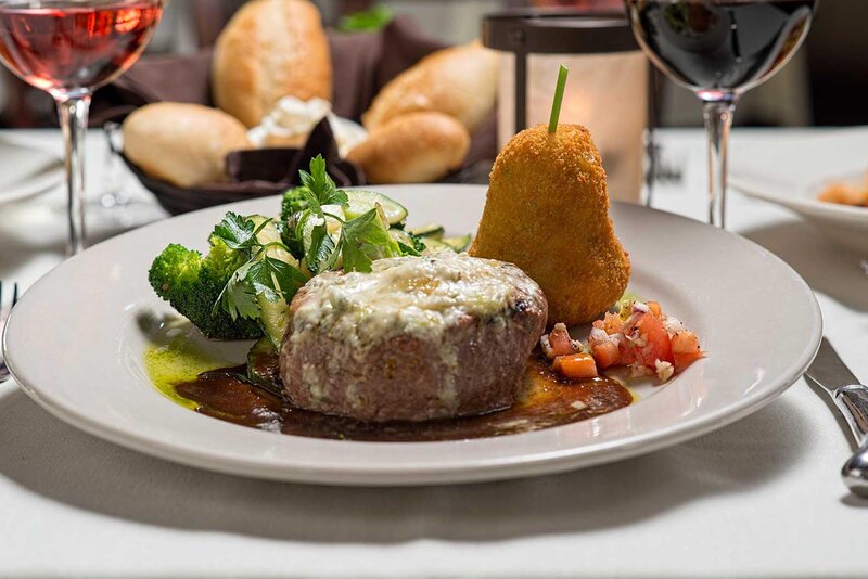 Steak entree with side of vegetables