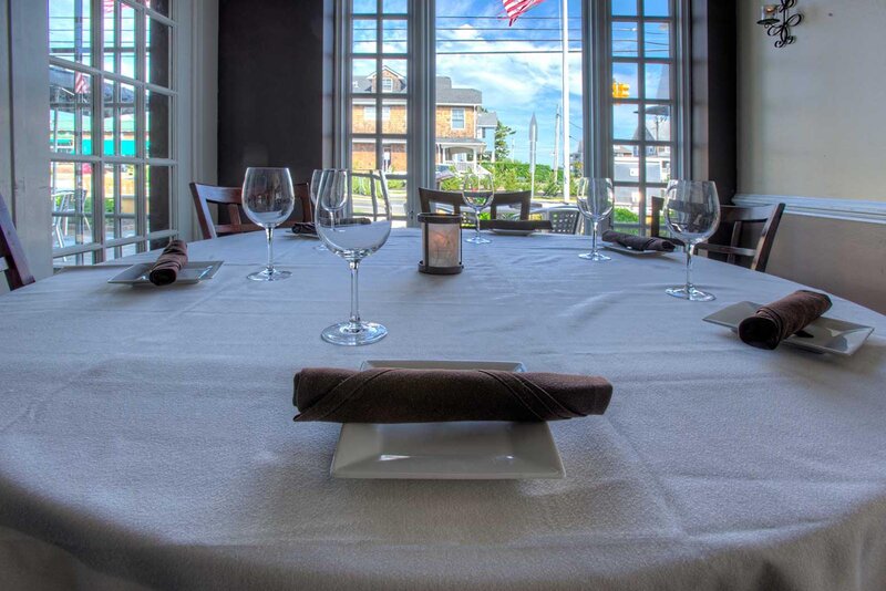 Dining room table set for four with view of the outside