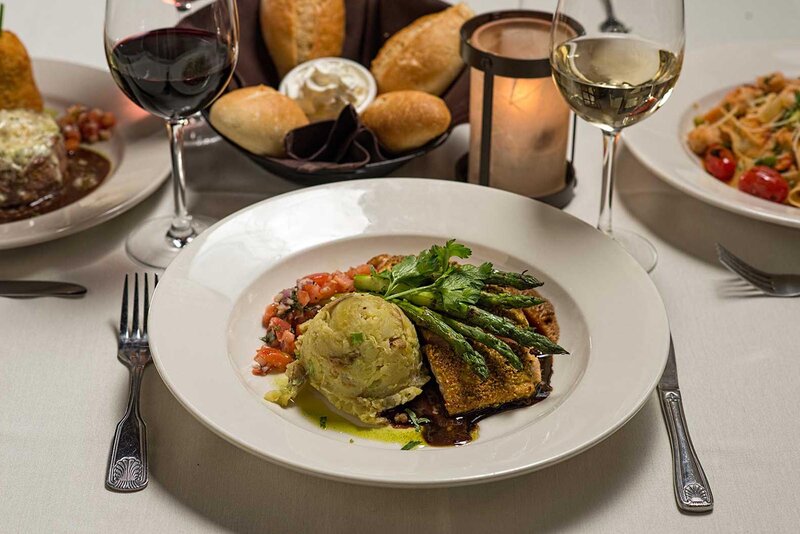 Fish entree with a side of asparagus and mashed potatoes